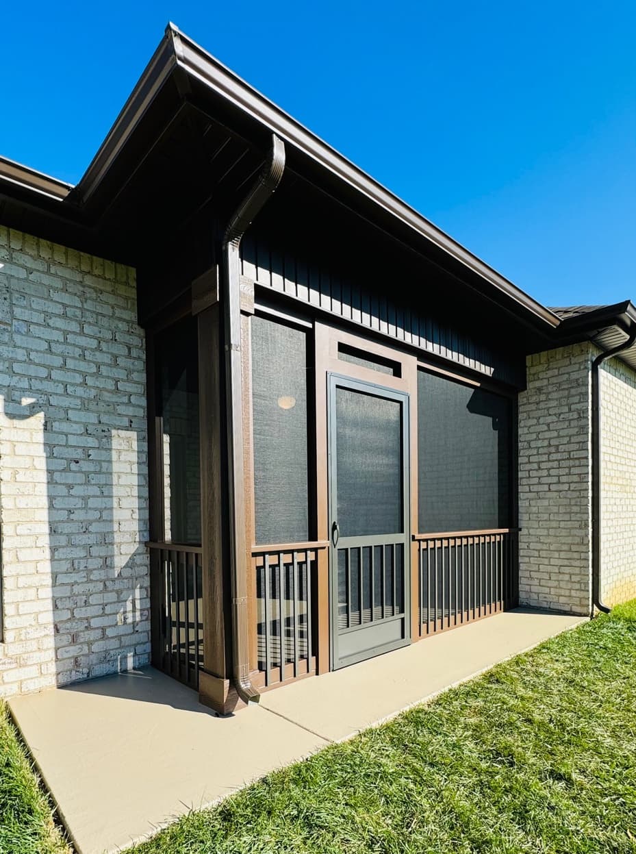Dark-Framed Screened Enclosure — Brick Home